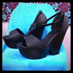 Brand new black wedge/platform sandals. Size 12W.